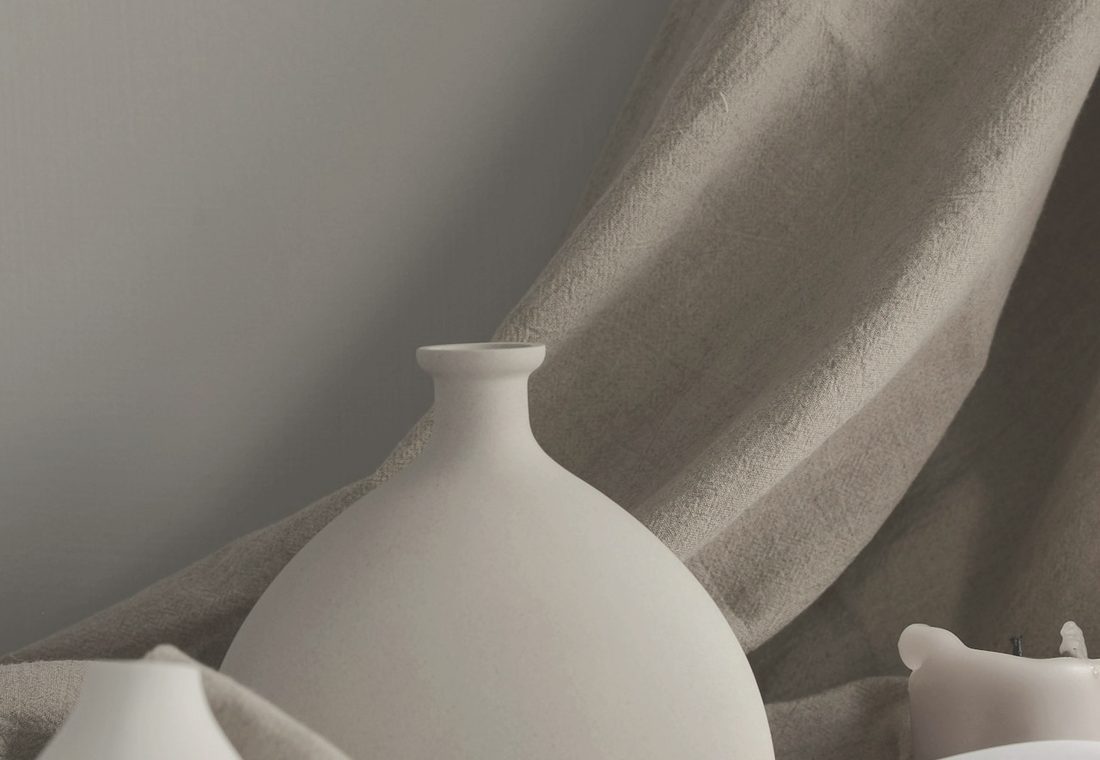 Ivory ceramics against natural linen